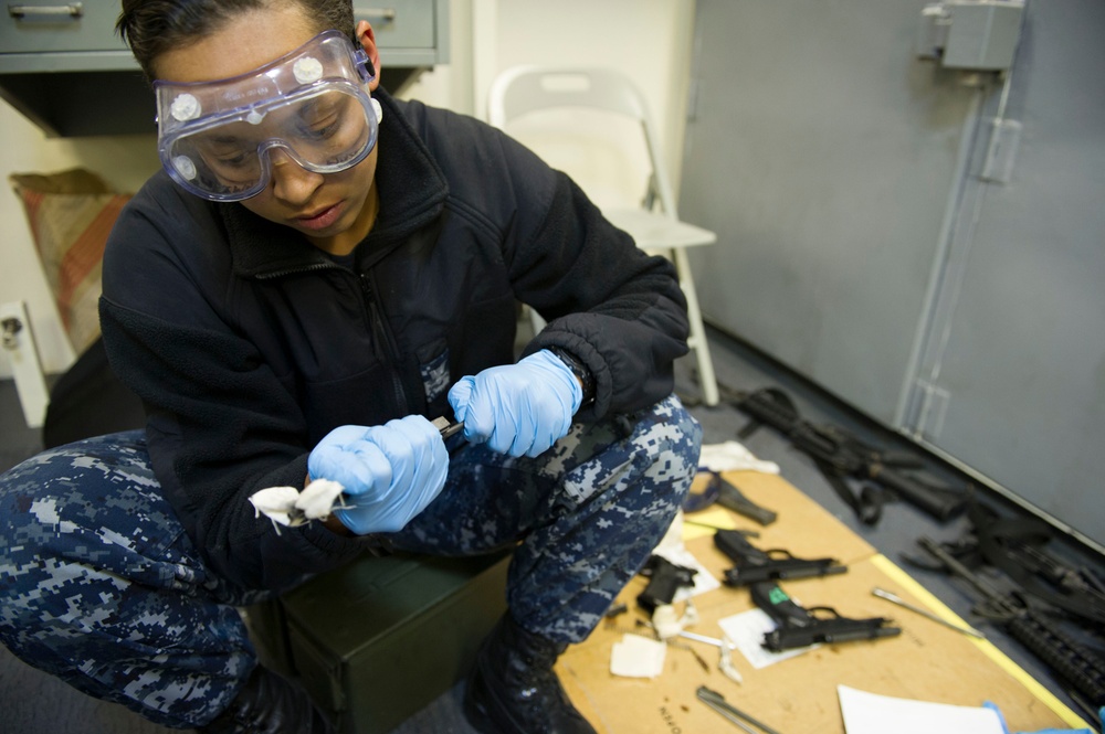 Future USS America armory sailors clean weapons
