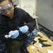 Future USS America armory sailors clean weapons