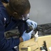 Future USS America armory sailors clean weapons