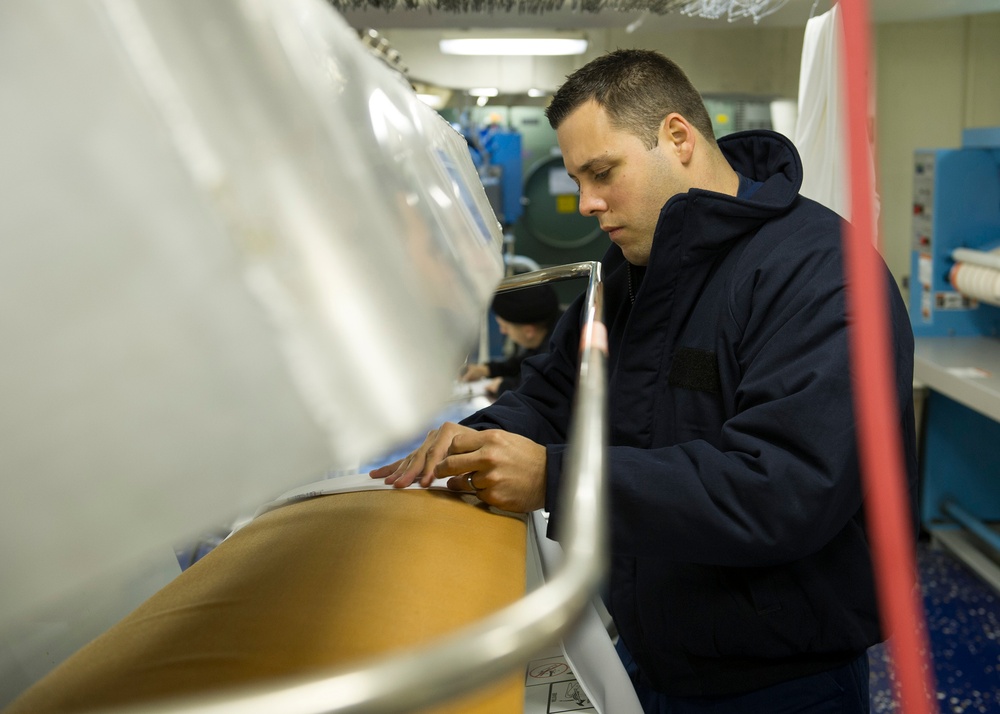 Operations aboard future USS America's laundry facilities