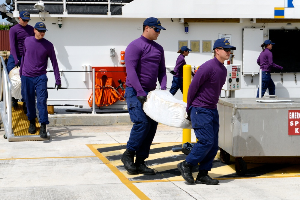 Coast Guard Cutter Paul Clark offloads an estimated 900 pounds of marijuana worth an estimated wholesale value of nearly $800,000