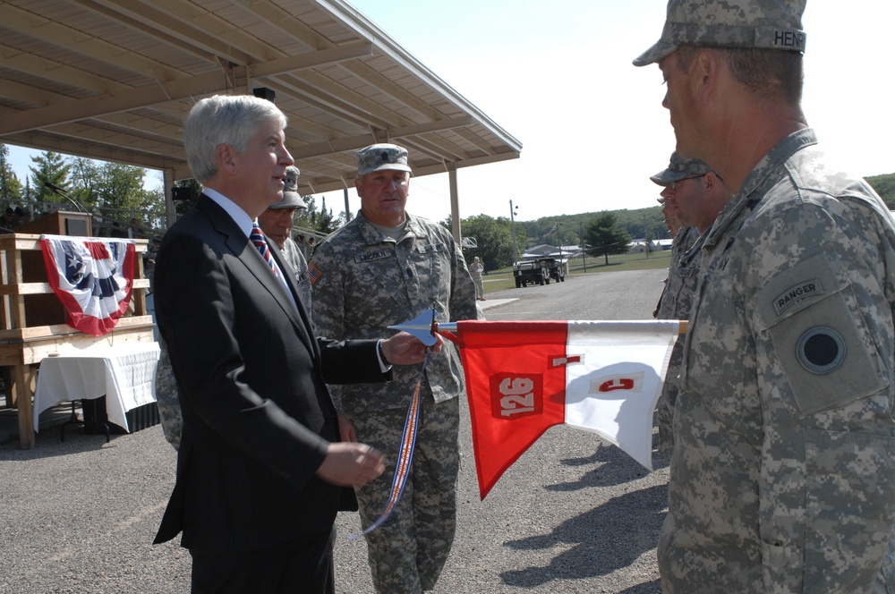 Michigan Gov. Rick Snyder performs pass in review of Michigan National Guard troops
