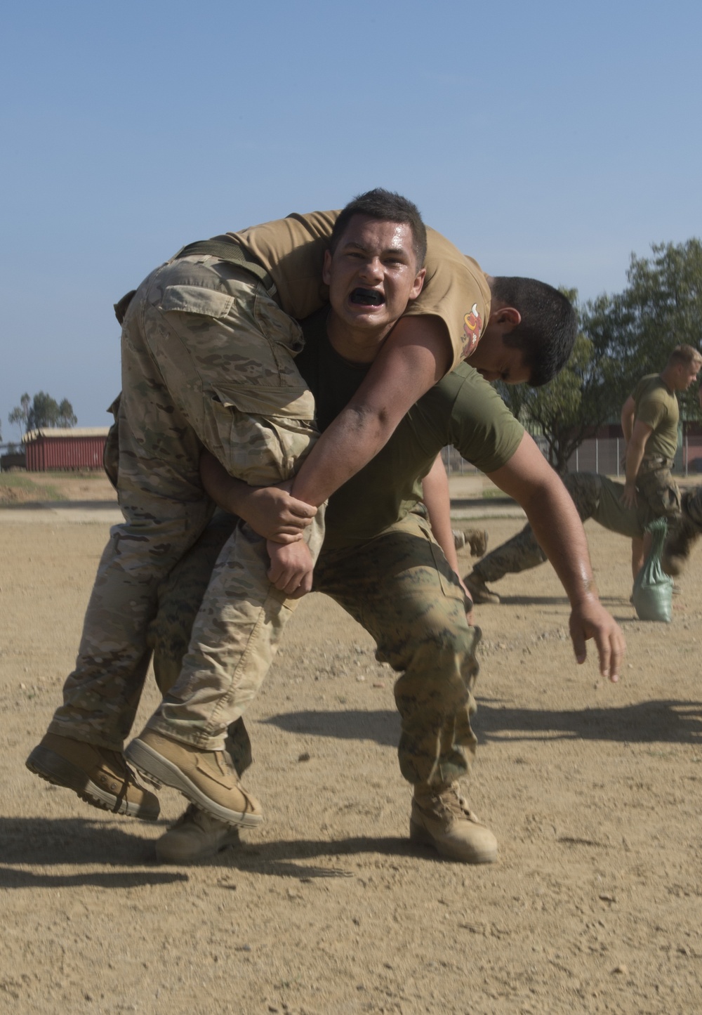 Reserve Marines from 1st Battalion 23rd Marines and Chilean Marines engage in physical training as part of an evolution during the Partnership of the Americas 2014 exercise.