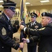 1st Sgt. Jim Davis hands the colors to Command Sgt. Maj. William Payne