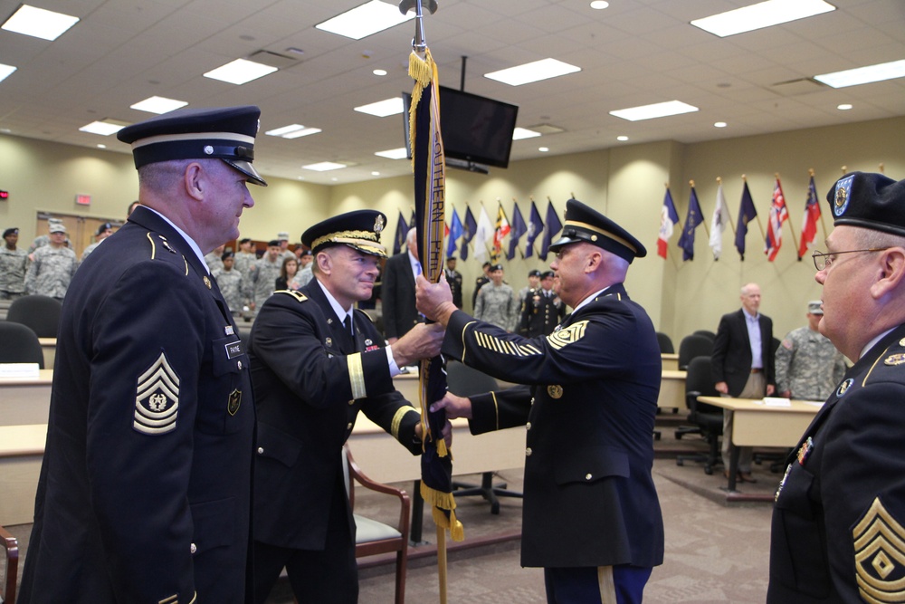 Maj. Gen. Beck hands the colors to Command Sgt. Maj. Law