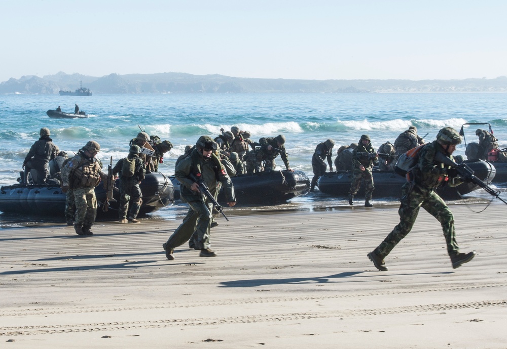 Marines rush the beach during a training evolution as part of Partnership of the Americas 2014