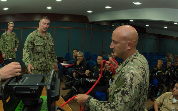 US Navy divers discuss their underwater robot with Colombian divers as part of Southern Partnership Station '14