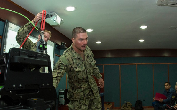 US Navy divers discuss their underwater robot with Colombian divers as part of Southern Partnership Station '14