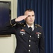 Spc. Boyd salutes at the CSM board