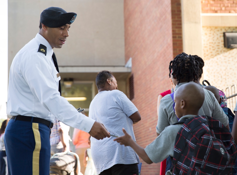 Soldiers welcome students back to school