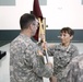 Maj. Gen. Bryan R.Kelly passes the company guidon to Capt. Ouellette, the incoming commander