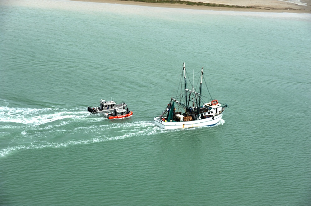 Mexican shrimping fleets depart the Port of Brownsville after safe harbor from Tropical Storm Dolly