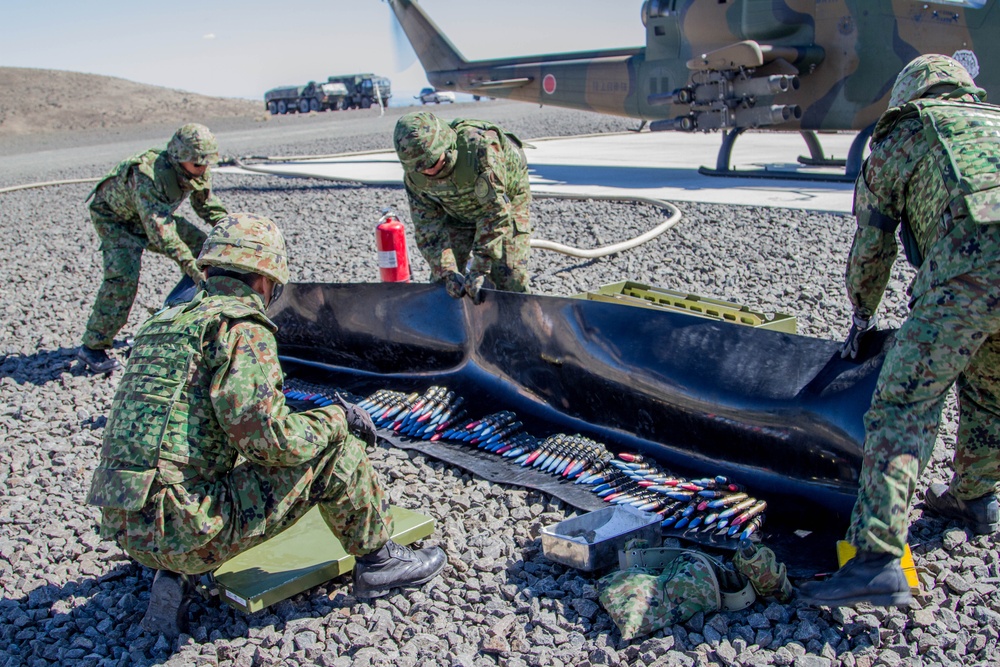Japan Defense Force members prepare ammo for Cobra