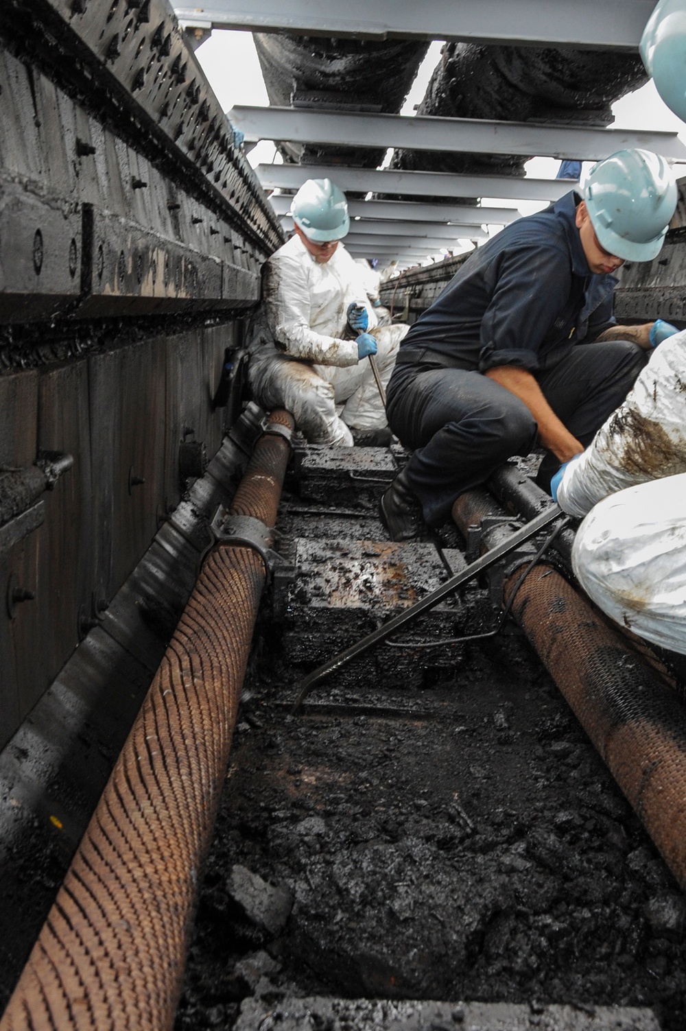 USS Ronald Reagan sailors clean catapult trench