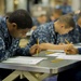 USS America sailors take first class petty officer advancement exam