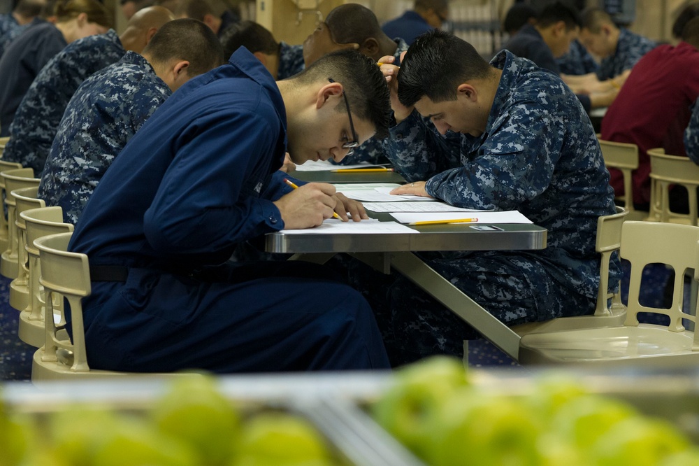USS America sailors take first class petty officer advancement exam