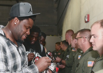 Coast Guard conducts flyover for football game