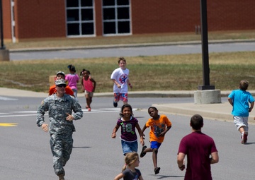 Soldiers welcome West Creek students back to school