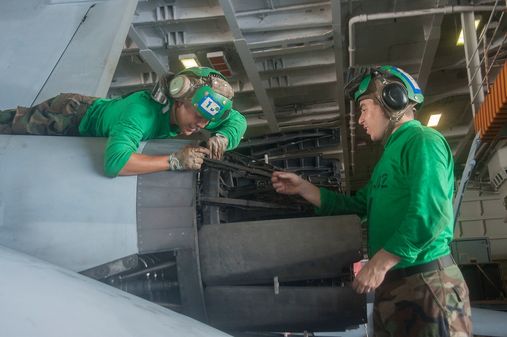 USS George Washington sailors perform maintenance