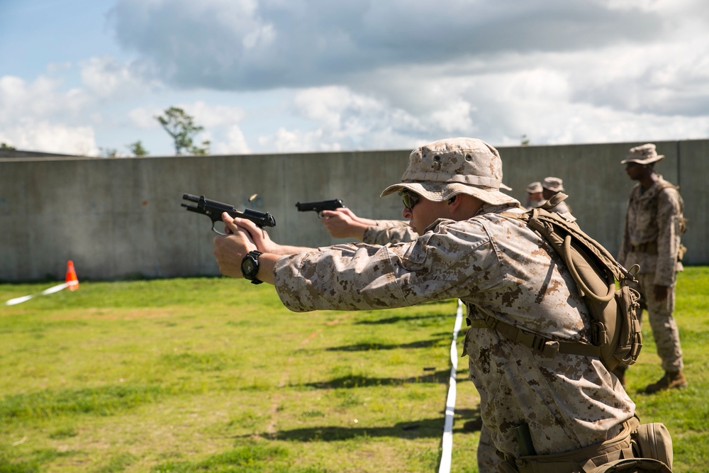 Marines engage in close-quarters pistol training
