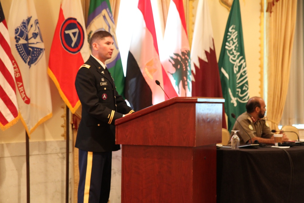 US Army captain speaks to multinational audience during Medical Security Symposium