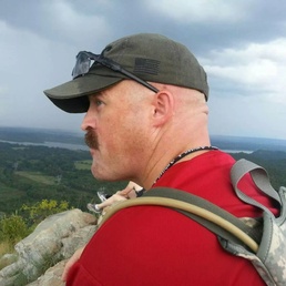 Milhon enjoying the view atop Pinnacle Mountain
