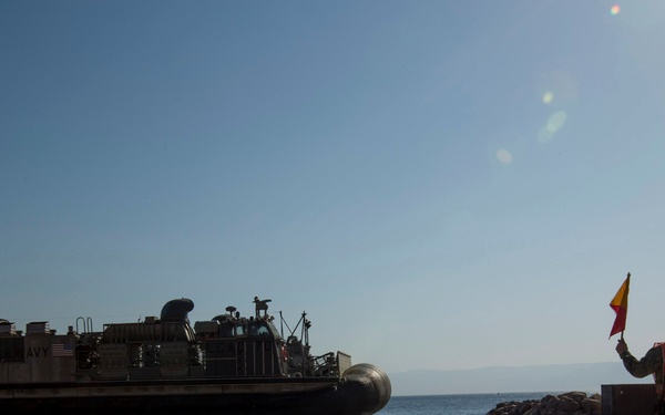 Mesa Verde transport vehicles aboard LCACs to start wash down