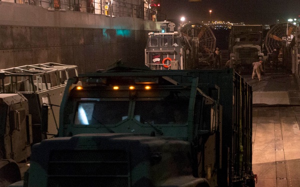 Mesa Verde transport vehicles aboard LCACs to start wash down