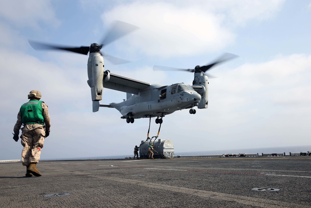 Osprey lifts a Harrier engine