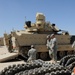 Soldiers inspect tracked vehicle before NTC