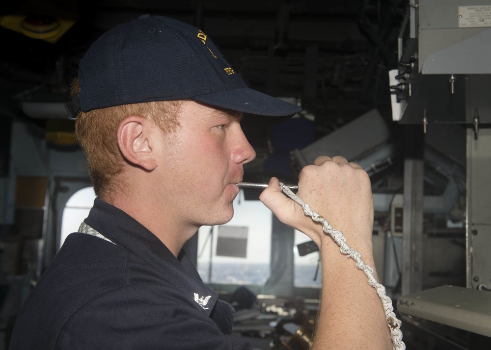 USS Rodney M. Davis sailor pipes message