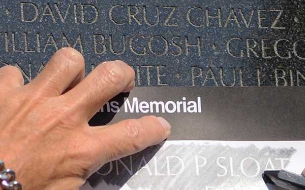 Family of MOH recipient Army Spc. 4 Donald P. Sloat makes solemn visit to Vietnam Wall
