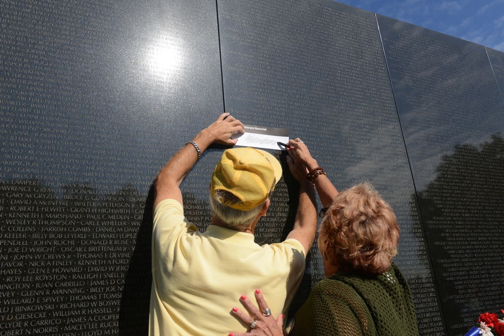 Family of MOH recipient Army Spc. 4 Donald P. Sloat makes solemn visit to Vietnam Wall