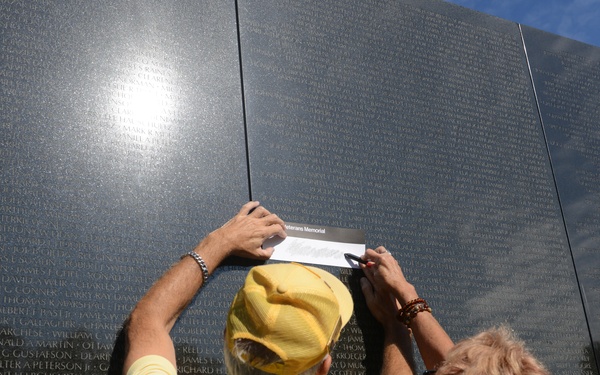 Family of MOH recipient Army Spc. 4 Donald P. Sloat makes solemn visit to Vietnam Wall
