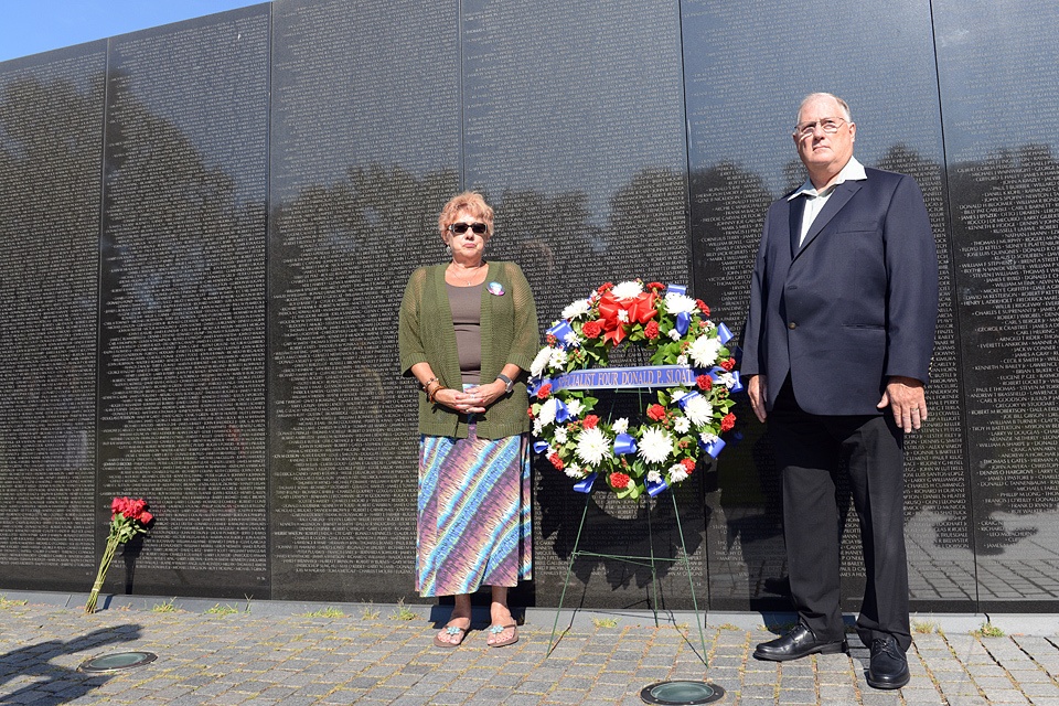 Family of MOH recipient Army Spc. 4 Donald P. Sloat makes solemn visit to Vietnam Wall