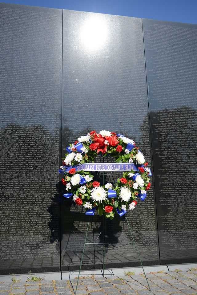 Family of MOH recipient Army Spc. 4 Donald P. Sloat makes solemn visit to Vietnam Wall