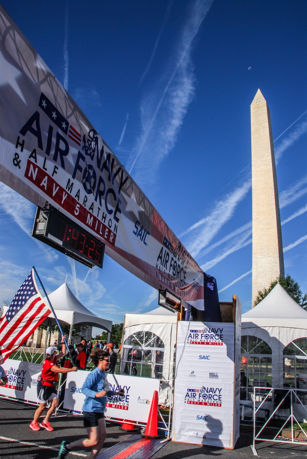 Finish line glory for the American flag at 2014 Navy-Air Force 5-Miler/Half-Marathon