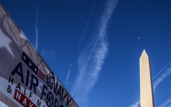 Finish line glory for the American flag at 2014 Navy-Air Force 5-Miler/Half-Marathon