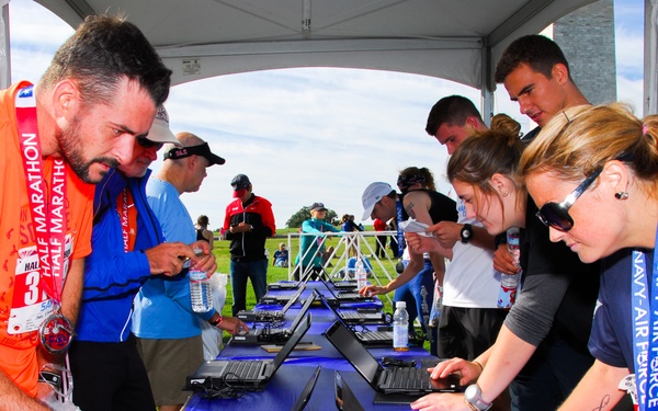 Runners check their times after Half-Marathon