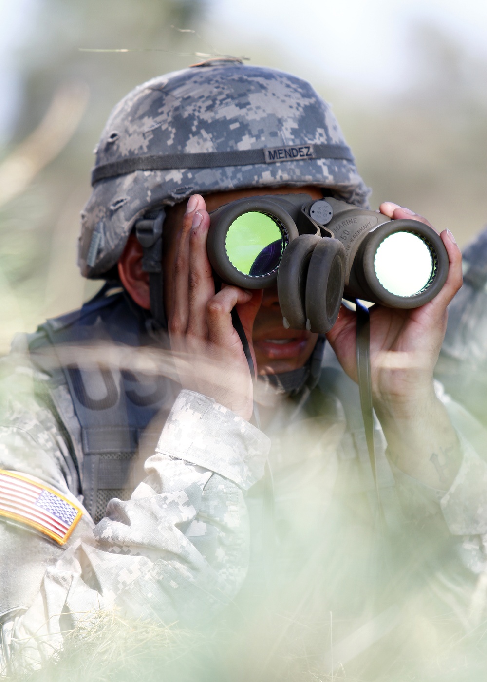 Spc. Roberto Mendez observes enemy at 2014 USAREUR Best Warrior Competition