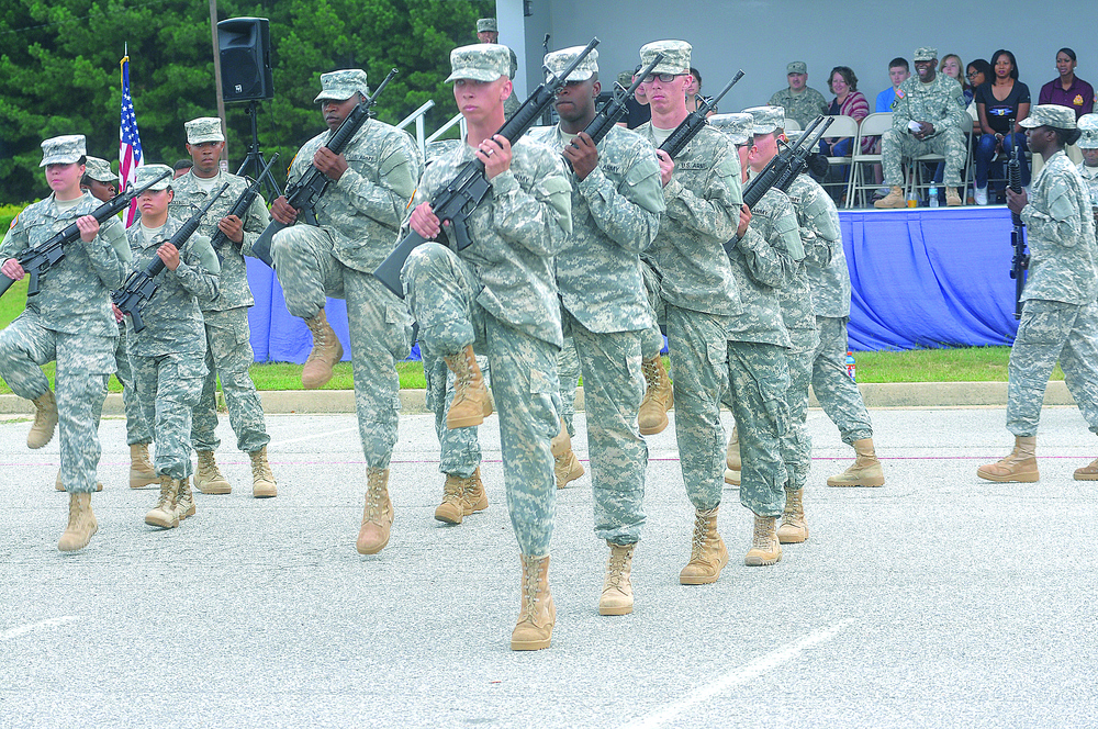 Soldiers high-step during drill and ceremony competition