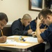 USS Halsey Sailors take petty officer 3rd class advancement exam