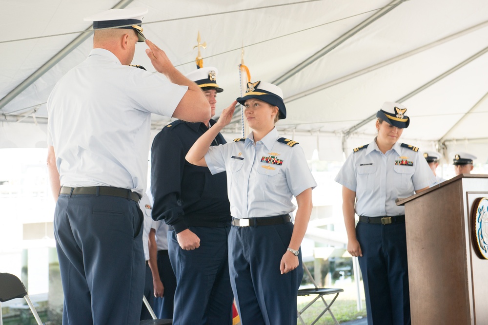 Exchange of salutes during the Decommissioning Ceremony for Coast Guard Cutter Jefferson Island