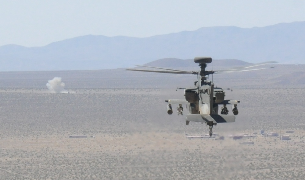 Apache Longbow attack helicopter hits target with Hellfire missile