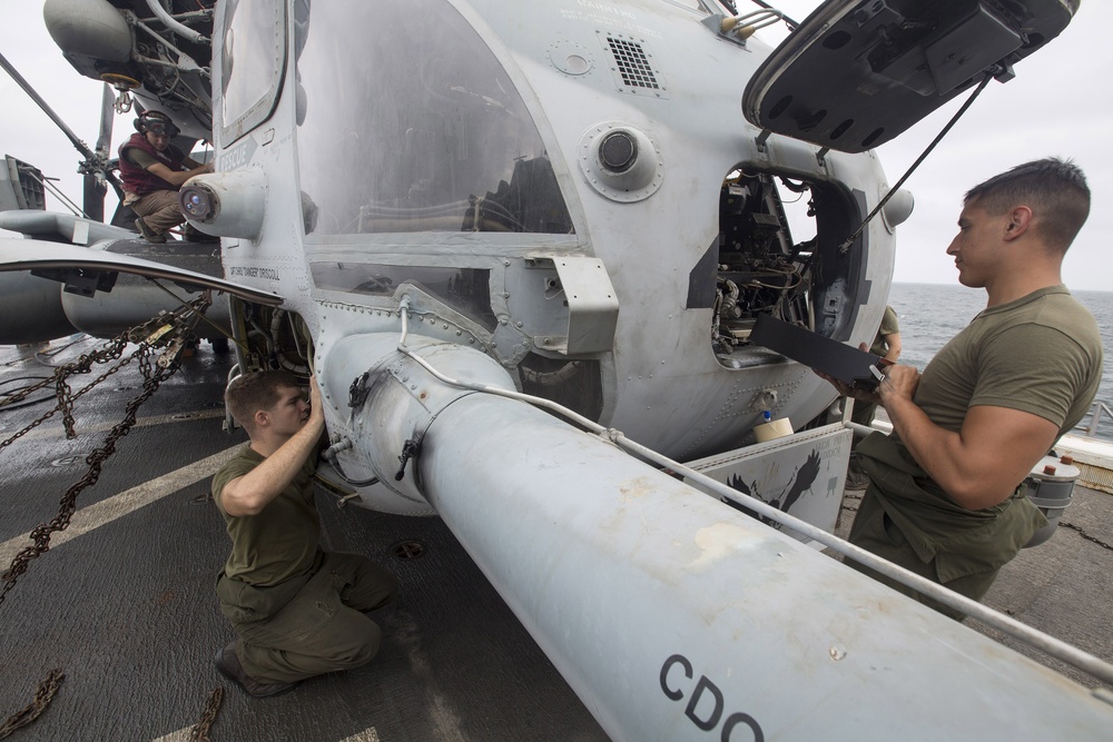 Marines perform preventive maintenance on Super Stallion aboard Mesa Verde