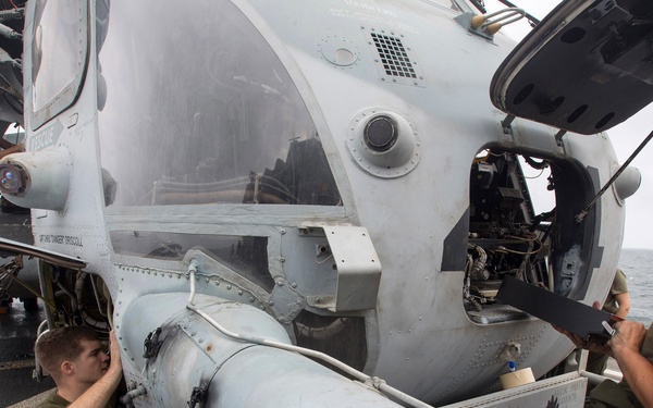 Marines perform preventive maintenance on Super Stallion aboard Mesa Verde