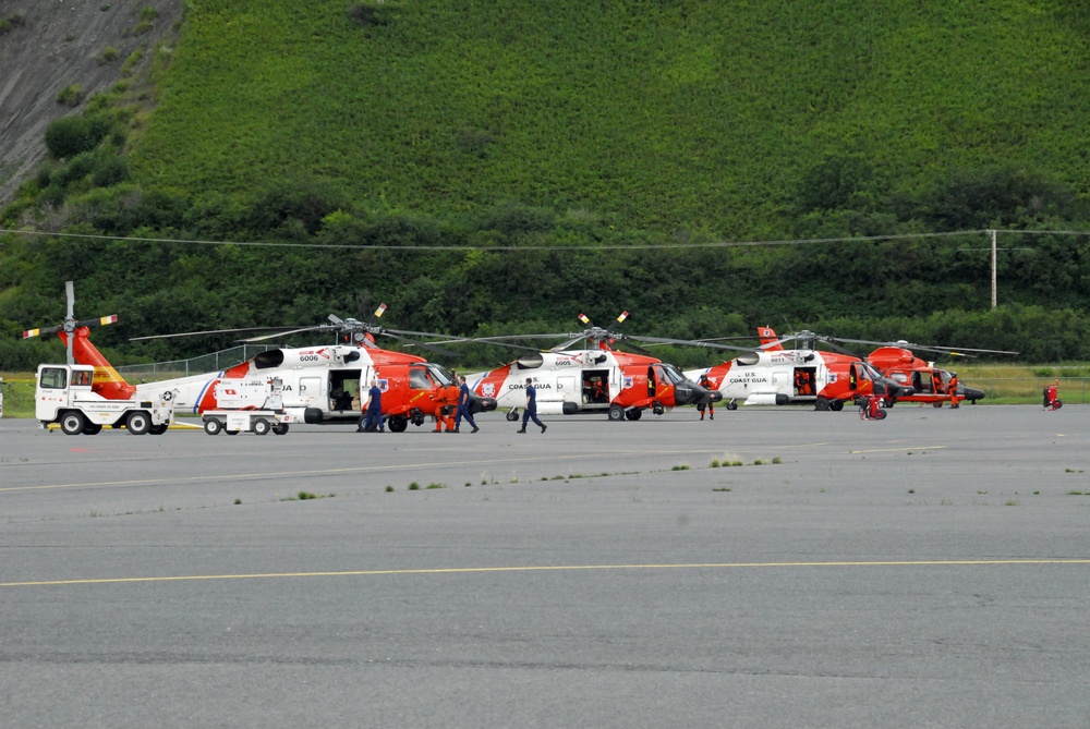 Coast Guard MH-60 Jayhawk and MH-65 Dolphin helicopters prepare for take-off in Kodiak, Alaska