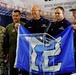 446th AW passes Seahawks' 12th-Man flag to Coast Guard