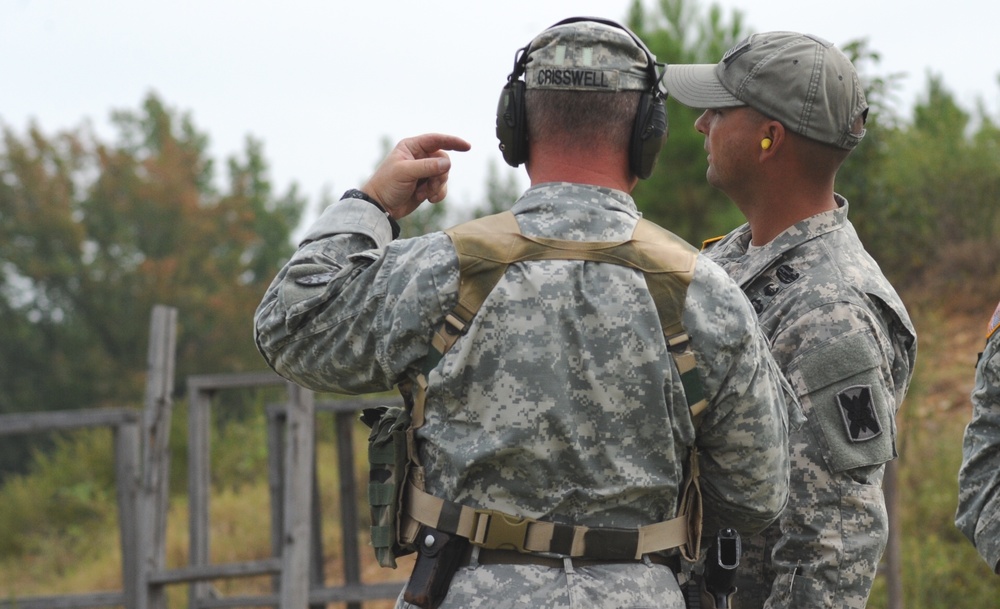 1st Sgt. Tommy McGee mentors a shooter during All Guard tryouts