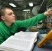 USS George Washington sailors at work